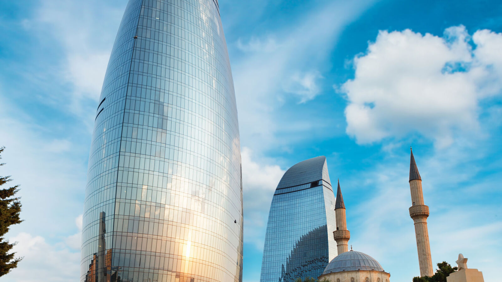 Flame Towers and a mosque minaret, Baku